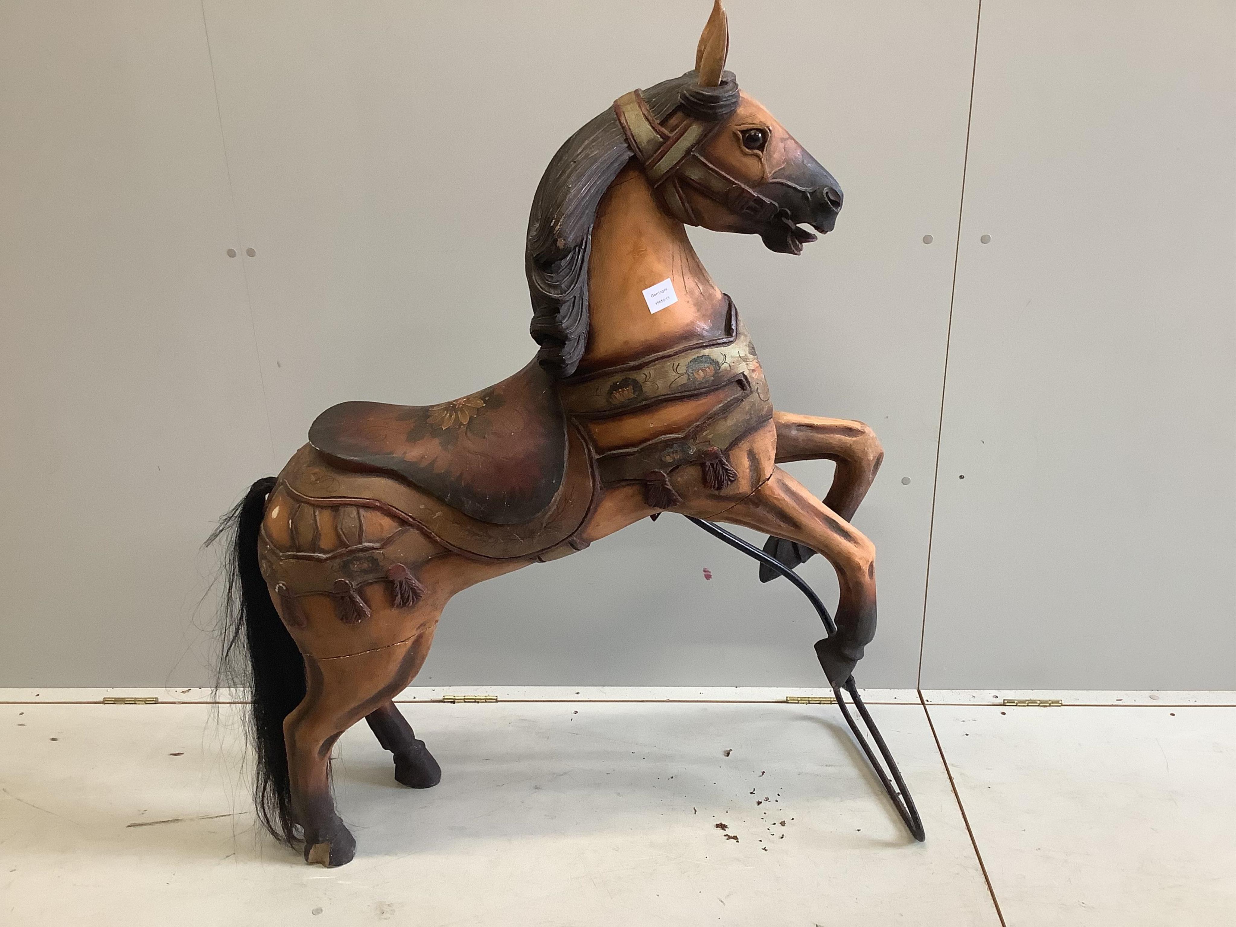 A Victorian style painted composition fairground style horse, height 130cm. Condition - fair